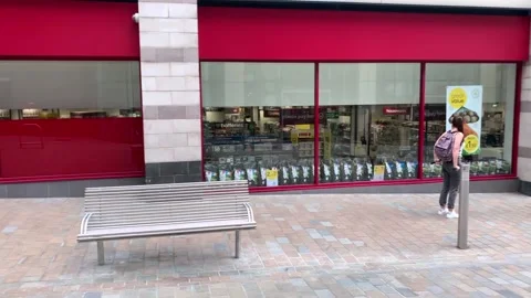 People queuing to enter a shop during the coronavirus crisis in Leeds, UK. Stock Footage 130327050