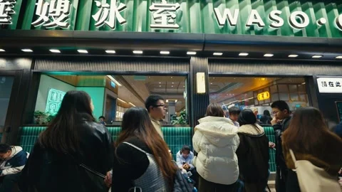 People Queuing in Front of a Cha Chaan Teng Hong Kong-style Cafe Diner in Stock Footage 332639733