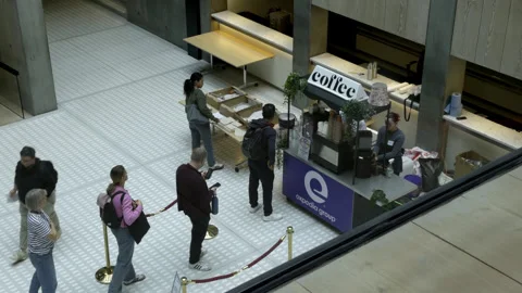 People Queuing at Indoor Coffee Stand in Corporate Office Atrium Stock Footage 346726558