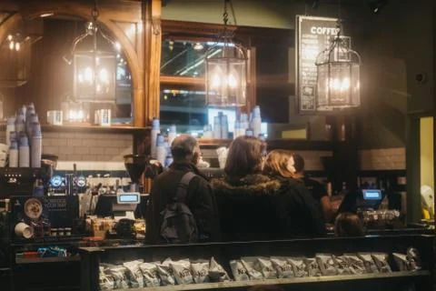 People queuing inside Cafe Nero, London, UK. Stock Photos