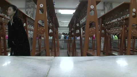 People queuing inside Kumsusan memorial palace, Pyongyang, North Korea Stock Footage 301871505