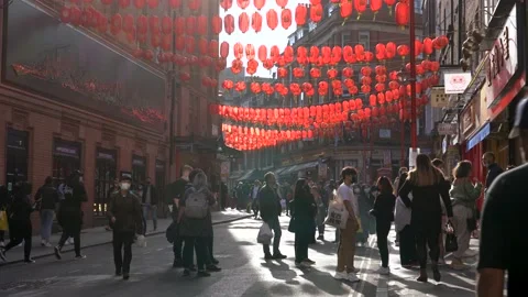 People queuing outside stores after lockdown easing in Chinatown, London Stock Footage 153334980