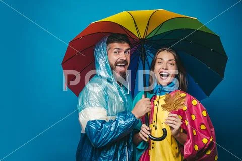 People in rain. The autumn mood and the weather are warm and sunny and rain is Stock Photos