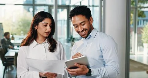 People, reading and document with tablet in office for planning, finance re.. Stock Photos