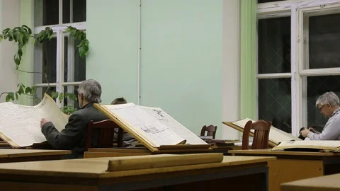People reading newspapers in the library Stock Footage 105829870