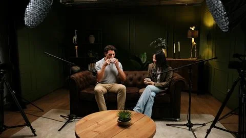 People recording interview for a podcast in a studio Stock Photos
