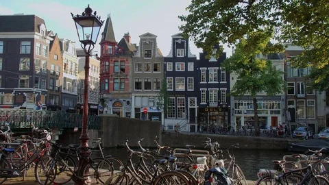 People relax at the canals of Amsterdam - a beautiful place Stock Footage