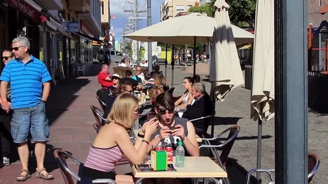 People relax in pavement cafe Stock Footage 85301682