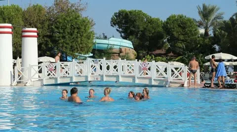 People relax by the pool Stock Footage 10875224