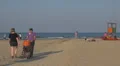 People relaxing and walking on the beach, Rimini, Italy, HD Footage