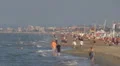 People relaxing and walking on the beach, Rimini, Italy, HD Footage