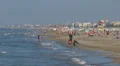 People relaxing and walking on the beach, Rimini, Italy, HD Footage