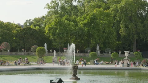 People Relaxing Around Central Fountain in Luxembourg Garden, Paris Stock Footage 340262423