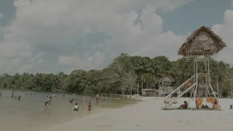 People relaxing on a beach at the Amazon River Stock Footage 188917468