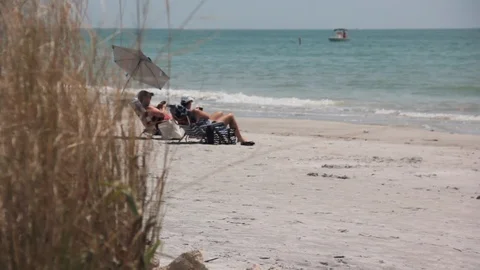 People relaxing on a Beach Stock Footage 108415977