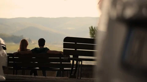 People relaxing on the benches Stock Footage 97930432