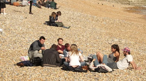 People relaxing at Brighton Beach Stock Footage 51615930