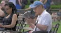 People relaxing in Washington Square Park New York City 4k or 4k+ Resolution