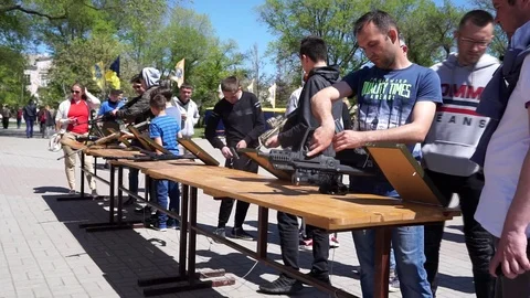 People reload weapons Stock Footage 107896954