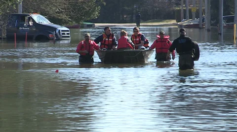 People rescued by fire department in spring flooding. Stock Footage 39364061