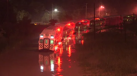 People rescued from stranded commuter train in Toronto flood after thunder storm Stock Footage 44384854