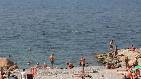 People rest on the beach Stock Footage 120003353