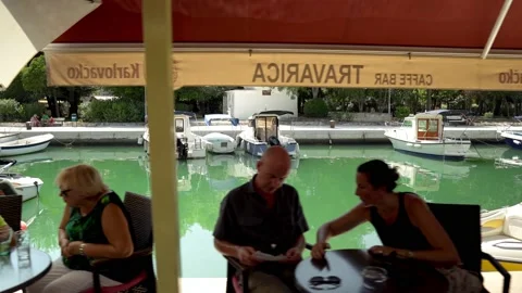 People rest in a cafe in Trogir Stock Footage 207037252