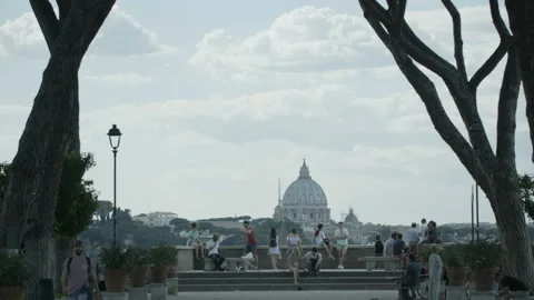 People Resting Under the Trees. Basilica in the Background Stock Footage 98604617