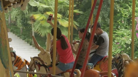 People ride on the carousel Stock Footage 77206737