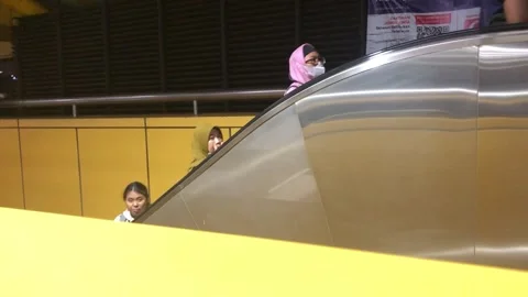People ride the escalator Stock Footage 306759662