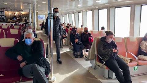 People ride a ferry boat crossing the Bosporus in Istanbul, Turkey 4K Stock Footage 166321405