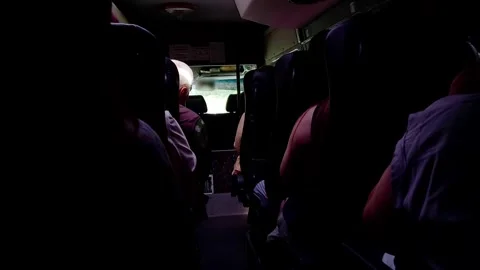 People ride in a passenger minibus inside, view from inside, background Stock-Footage 303620956