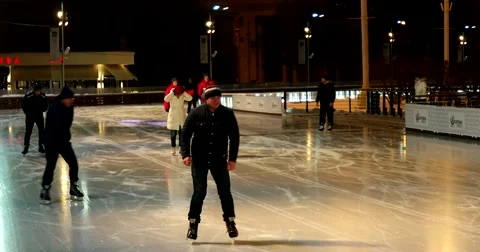 People ride on skates, one of them falls to the ice Stock Footage 67767341