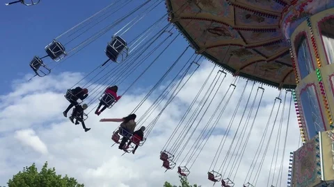 People riding a chain carousel Stock Footage 71133253