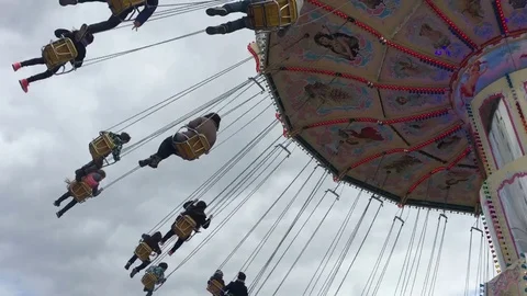 People riding a chain carousel Stock Footage 71133607