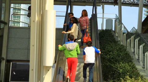 People Riding Up Escalator Video stock 39654095