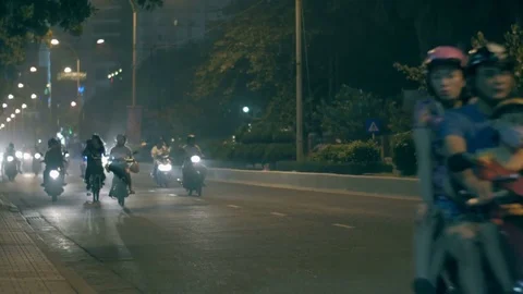 People riding on mopeds at night 스톡 동영상 73530697