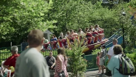 People riding the roller coaster 4k Vídeo Stock 76580945