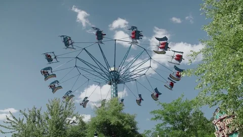 People riding the roller coaster 4k Stock Footage 76584678