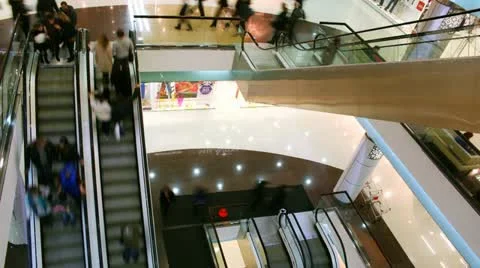 People rise and go down on escalator in shopping center - Time lapse Stock Footage