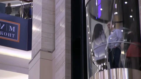 People rise in a transparent glass eleva... | Stock Video | Pond5