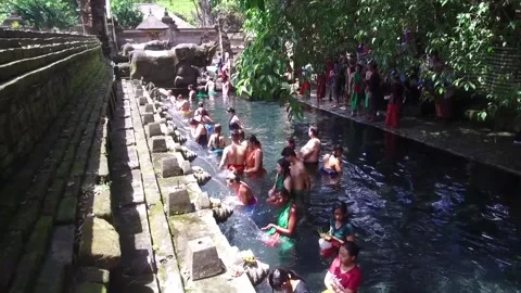 People ritually bathing in Tirta Empul Temple in Bali, Indonesia2 Stock Footage 131154339