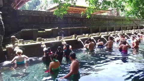 People ritually bathing in Tirta Empul Temple in Bali, Indonesia Stock Footage 131154345