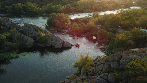 People on the River rafts at sunset Stock Footage 127110419