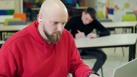 People at the robotics lessons, writting important things and trying to do the Stock Footage 165294655