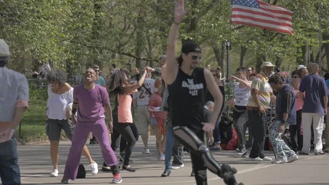 People roller skating and dancing in Central Park Stock Footage 114246811