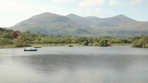 People rowing, doing activities on beautiful lake on vacations, summer holidays Stock Footage 45124397