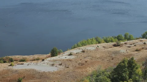 People run along the river. Jogging on the coast. Stock Footage 130391920