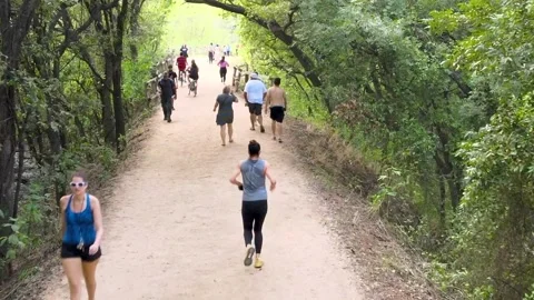 People Running and Biking on Trail Stock Footage