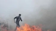 People Running Away From Fire Stock Footage
